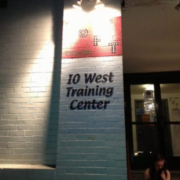 IO West stage door, signage